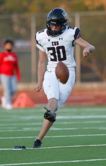 Faith Lutheran High School's Caden Chiitenden (30) kicks off against Liberty High School during ...