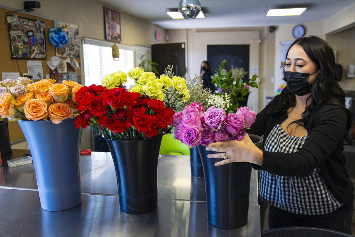 Theresa Arana, head florist at Chapel of the Flowers, arranges flowers, on Wednesday, Sep. 22, ...