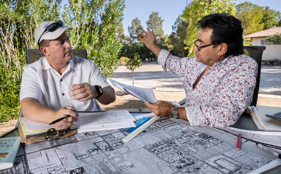 Biagio Guerra, right, and Jerry Pavelec discuss their opposition to a proposed housing developm ...