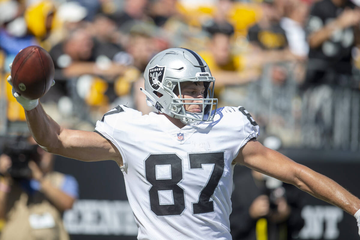 Raiders tight end Foster Moreau (87) prepares to spike the football after scoring a touchdown d ...