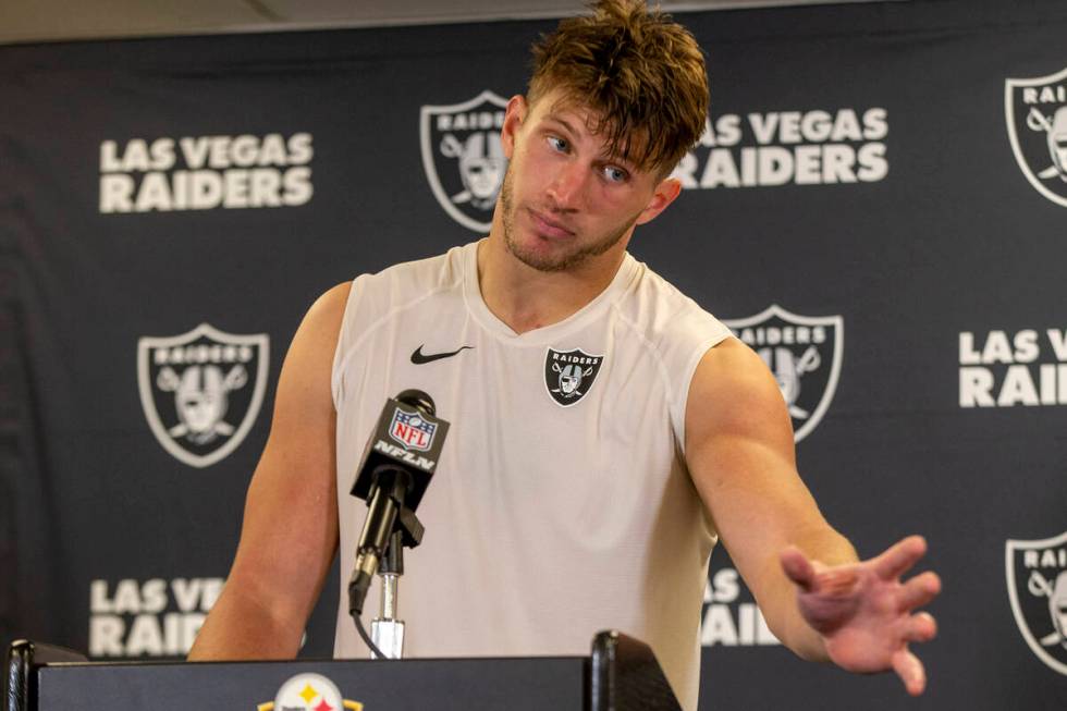 Raiders tight end Foster Moreau (87) gestures to a reporter during a news conference after an N ...