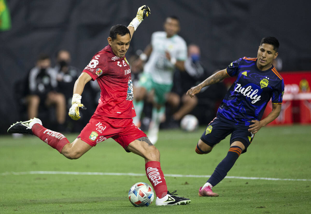 Leon goalkeeper Rodolfo Cota (30) kicks the ball back into play next to Seattle Sounders forwar ...