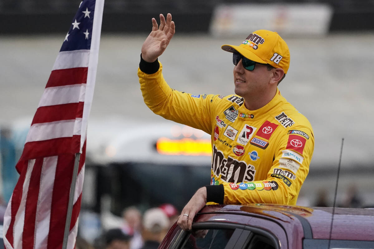 Kyle Busch waves to fans before a NASCAR Cup Series auto race at Bristol Motor Speedway Saturda ...