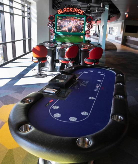 A gaming table and a video blackjack machine are displayed at the Black Fire Innovation center ...