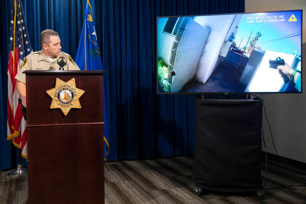 Assistant Sheriff Andrew Walsh shows body camera footage from the scene of a police shooting on ...