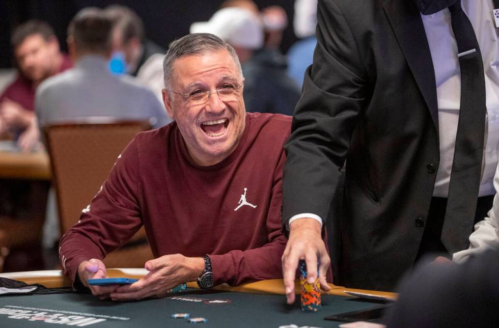 Professional poker player Eli Elezra plays laughs as chips are counted during the $25,000 buy-i ...