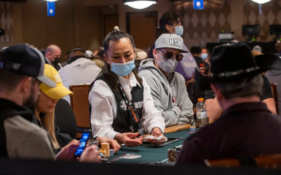 Players sport a variety of hats during a $500 casino employees event on the first day of the Wo ...