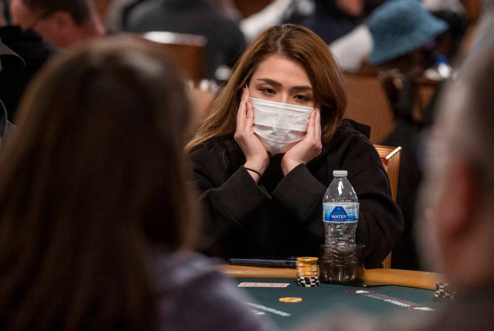 Player Emi Painter of Las Vegas waits her turn to bet during a $500 casino employees event on t ...