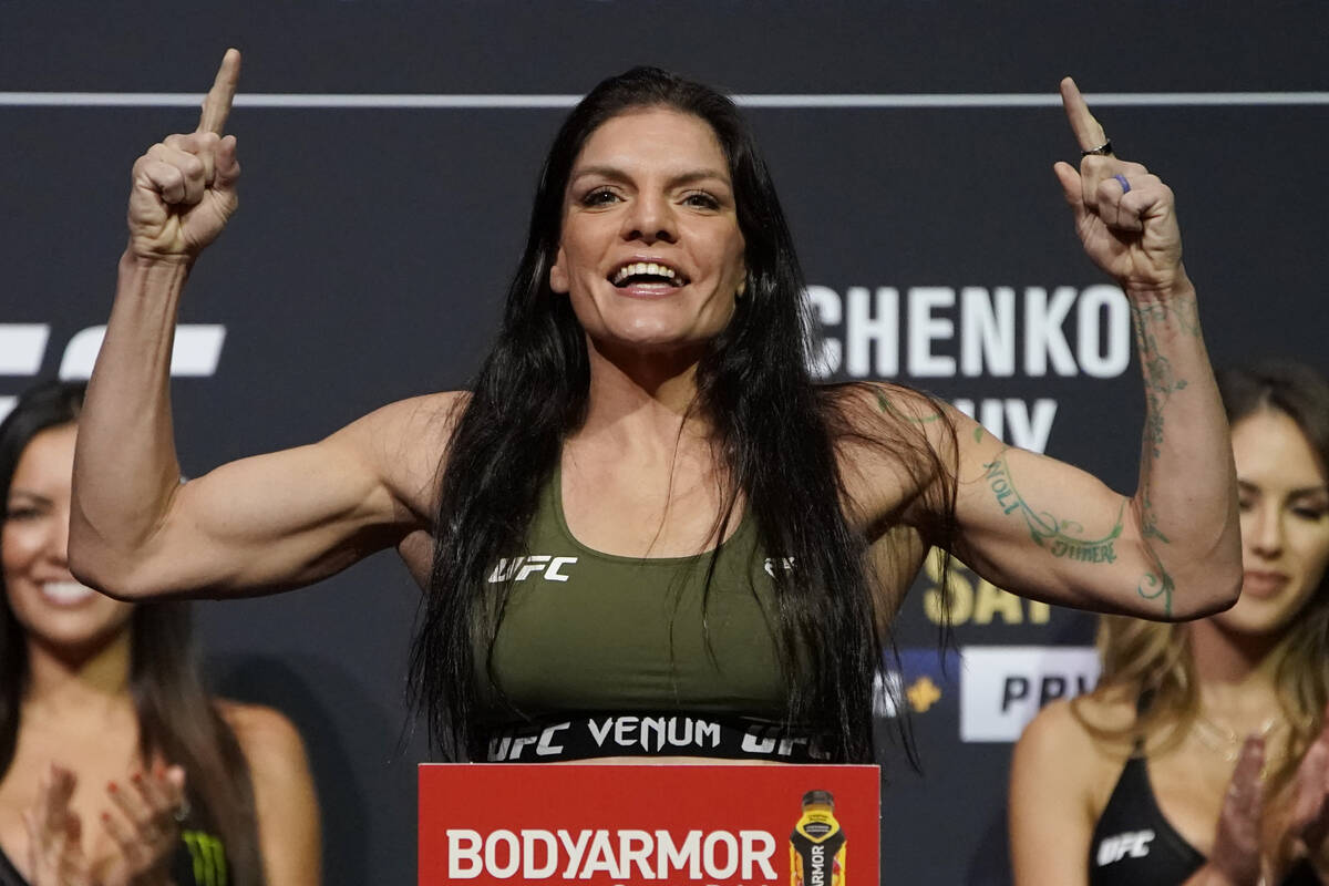 Lauren Murphy poses during a ceremonial weigh-in for a UFC 266 mixed martial arts bout Friday, ...