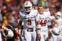 Bowling Green quarterback Matt McDonald (3) smiles in celebration after winning 14-10 against M ...