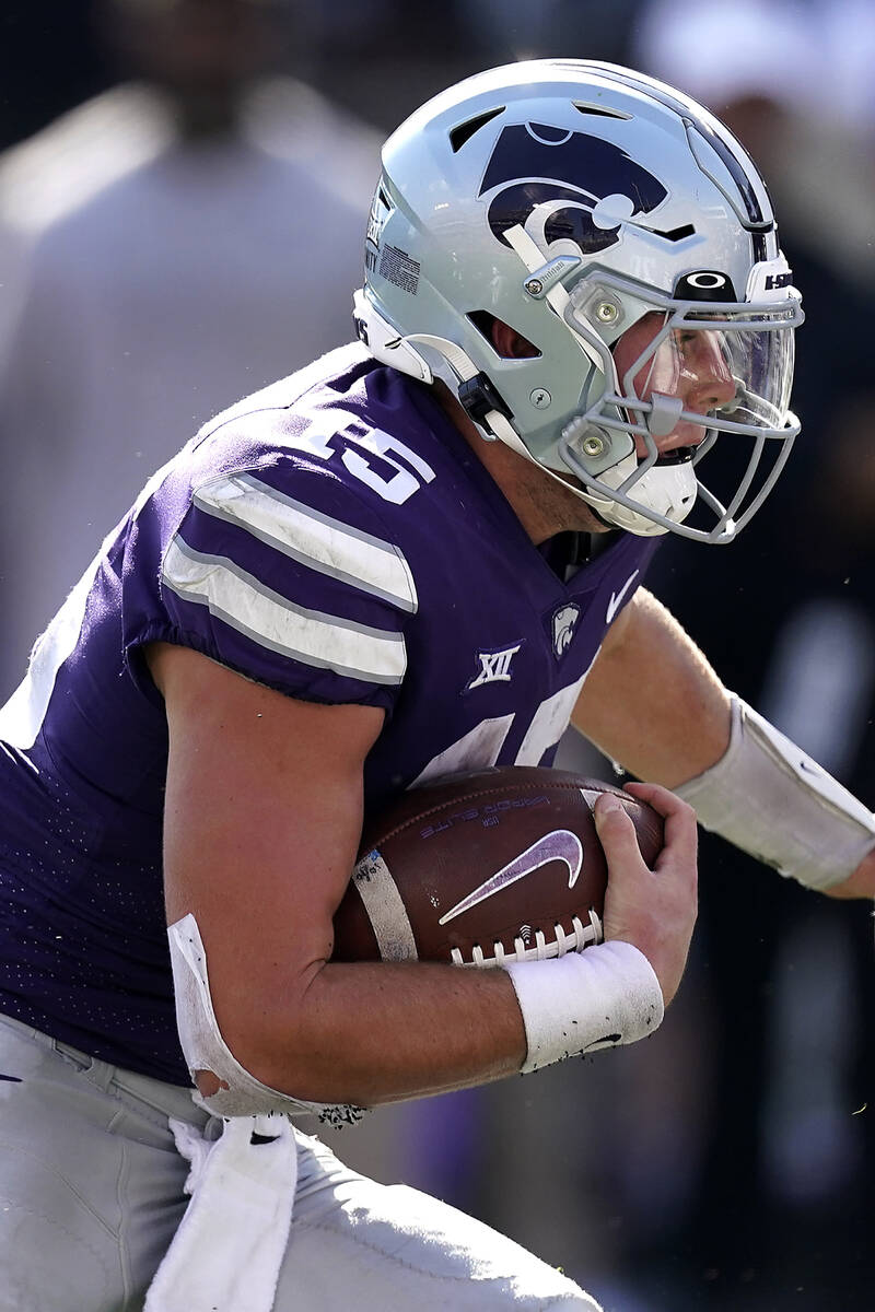 Kansas State quarterback Will Howard runs for a touchdown during the second half of an NCAA col ...