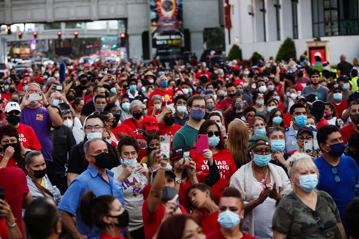 Members and supporters of the Culinary Workers Union Local 226 march on the Strip to bring atte ...
