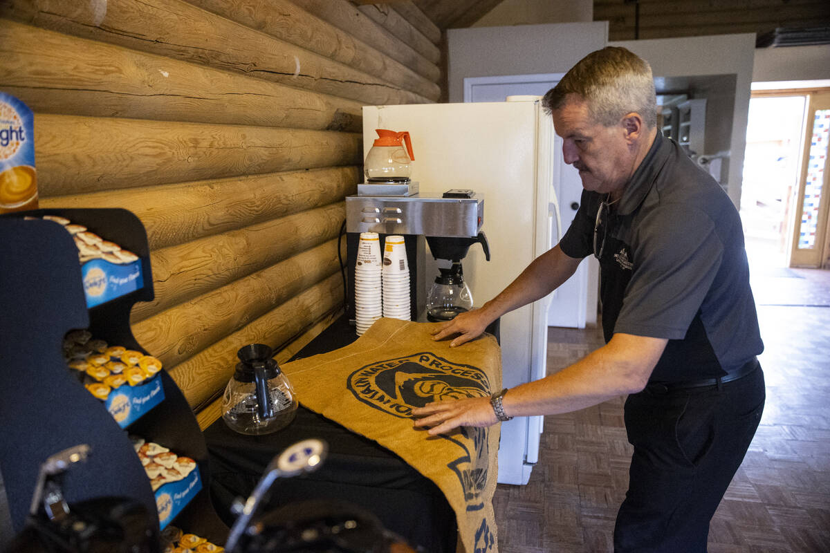 Operations manager Thomas Schnekloth sets up a coffee table at the Mt. Charleston Lodge in Las ...