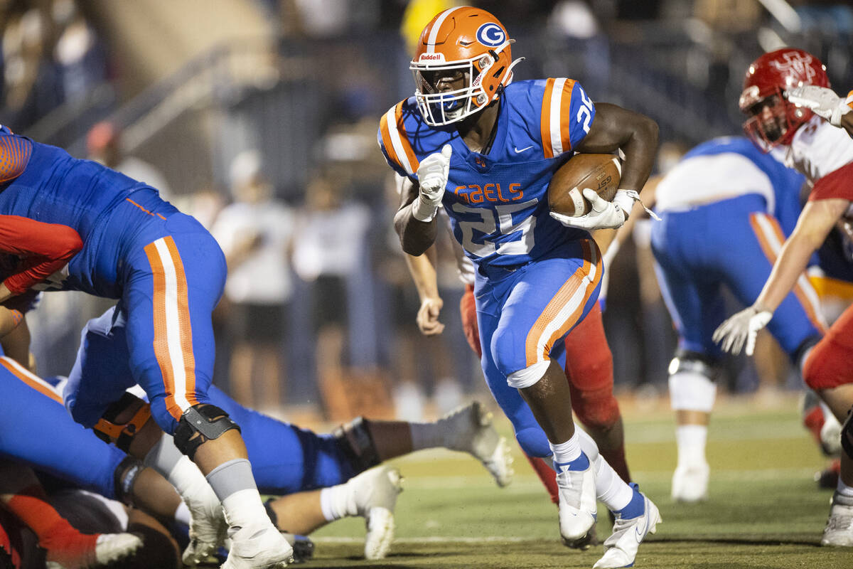 Bishop Gorman's William Stallings Jr (25) runs the ball for a touchdown during the first half o ...