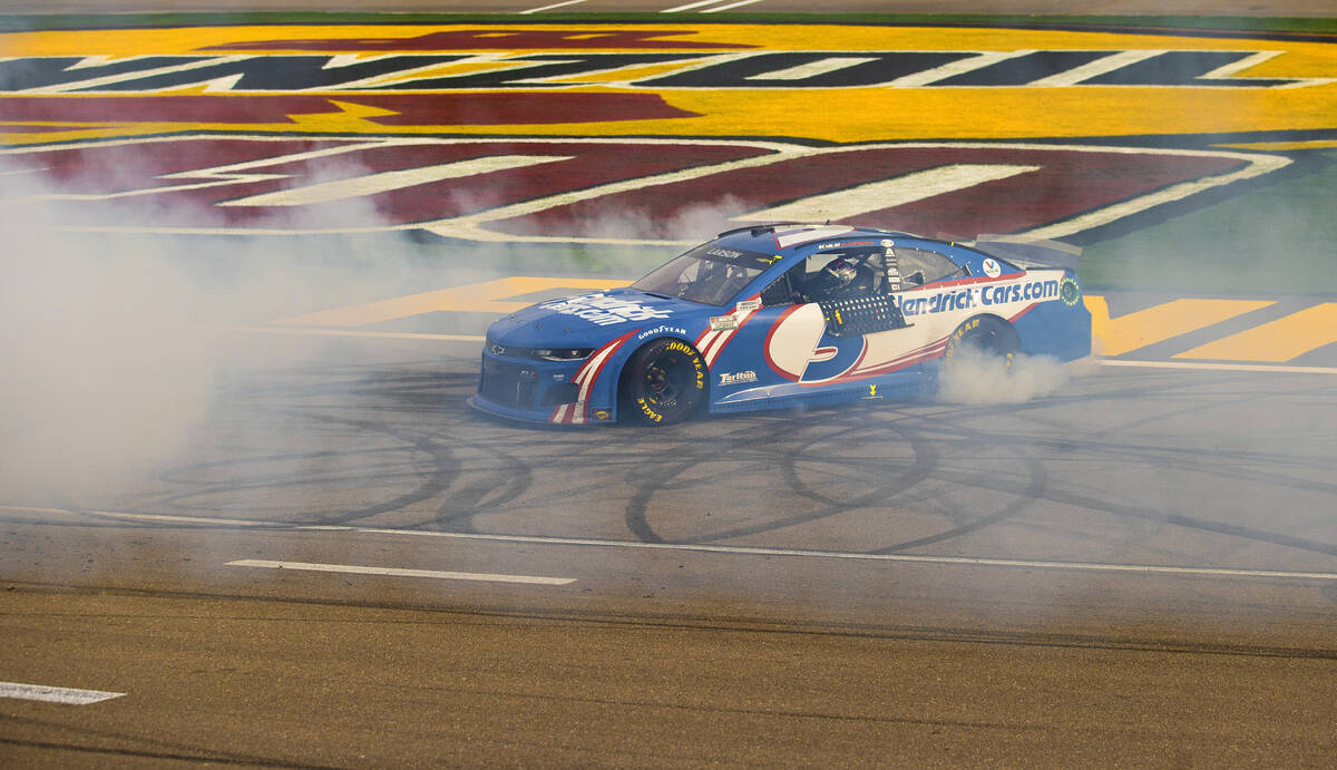 NASCAR Cup Series driver Kyle Larson (5) celebrates with a burnout after winning the NASCAR Cup ...