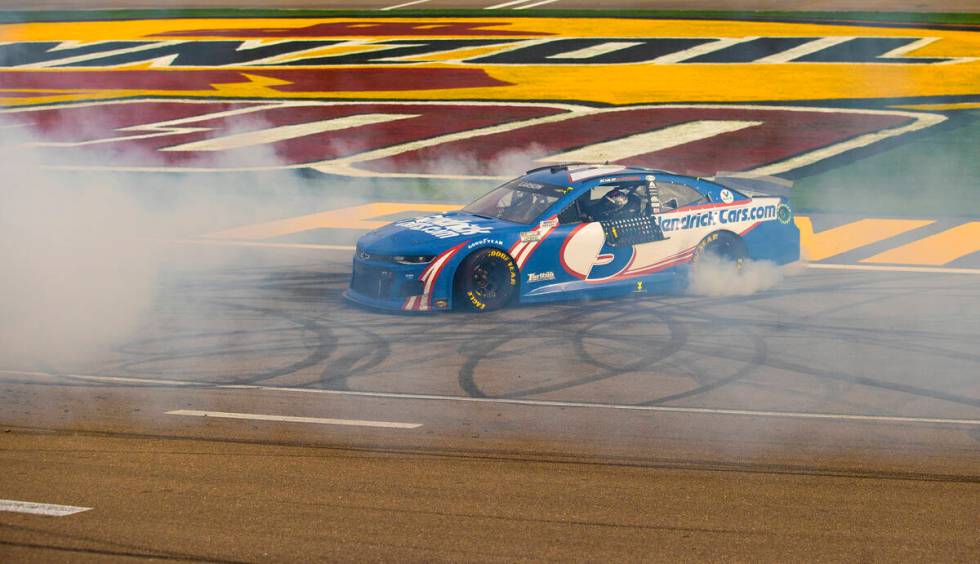 NASCAR Cup Series driver Kyle Larson (5) celebrates with a burnout after winning the NASCAR Cup ...