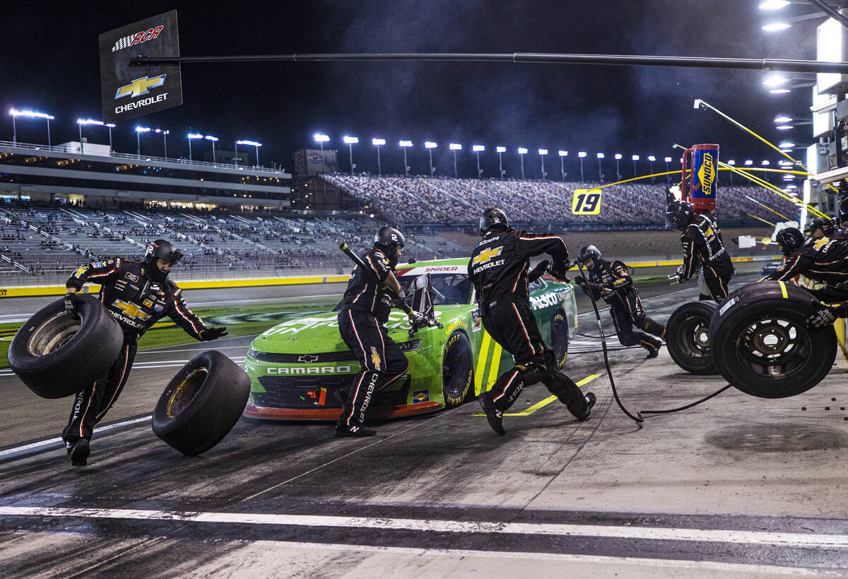 The pit crew works on Myatt Sniders car during the Alsco Uniforms 302 NASCAR Xfinity series rac ...