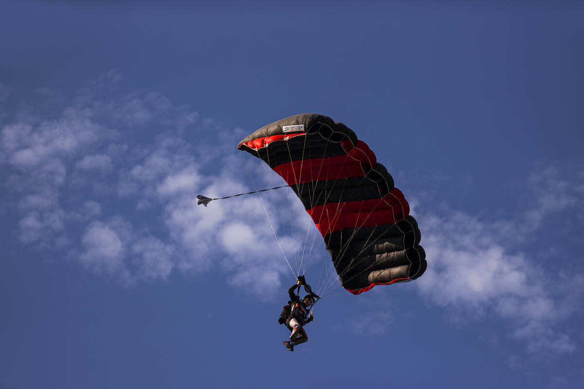 Driver Matt Jaskol parachutes into Las Vegas Motor Speedway before the start of the Alsco Unifo ...