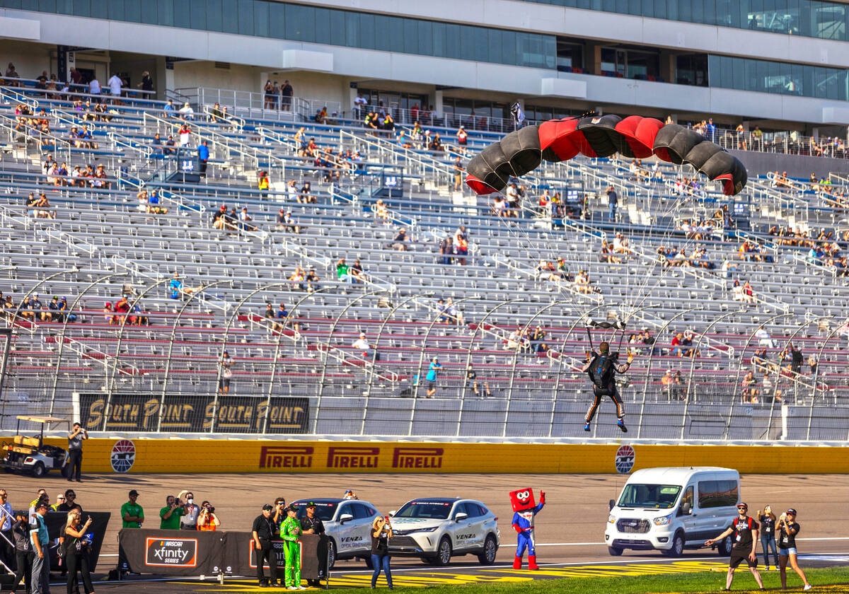 Driver Matt Jaskol parachutes into Las Vegas Motor Speedway before the start of the Alsco Unifo ...