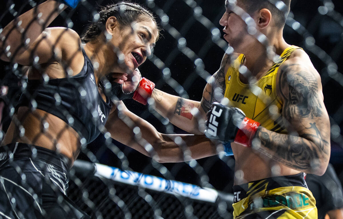 Cynthia Calvillo, left, is punched on the chin by Jessica Andrade during their women's flyweigh ...