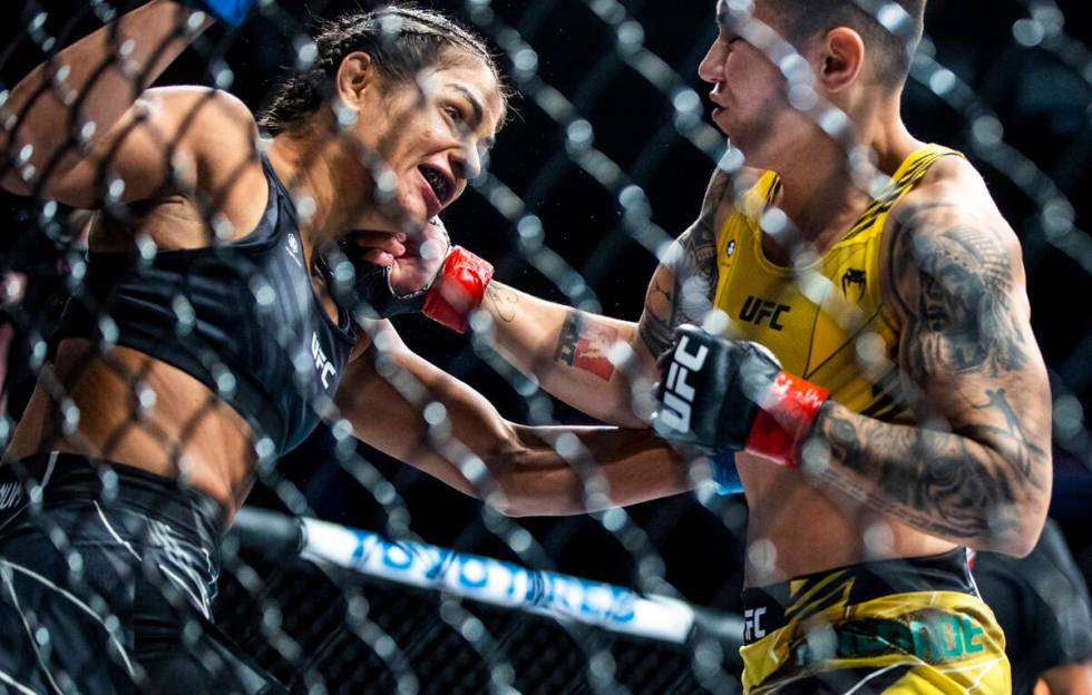 Cynthia Calvillo, left, is punched on the chin by Jessica Andrade during their women's flyweigh ...