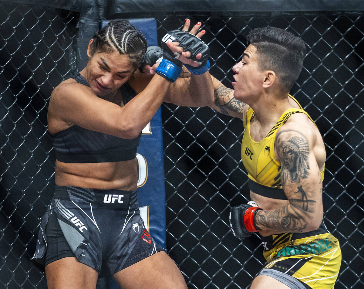 Cynthia Calvillo, left, is punched on the head by Jessica Andrade during their women's flyweigh ...