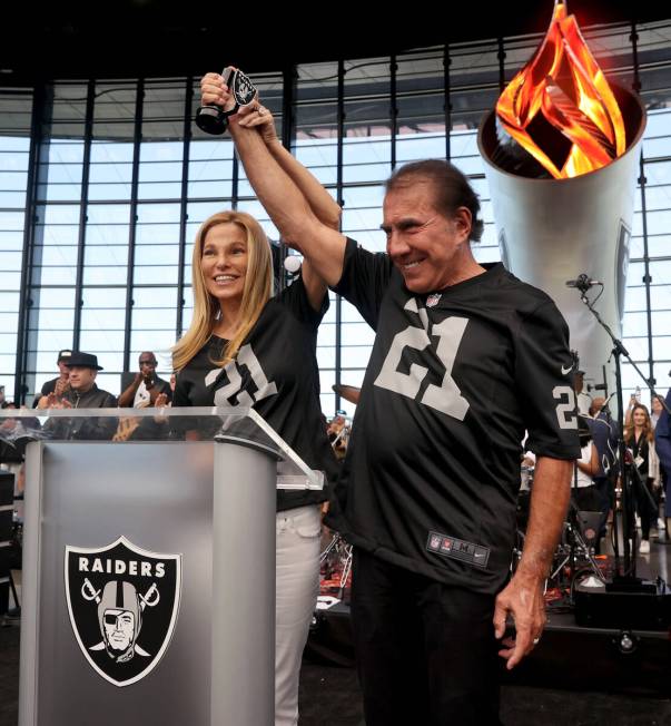 Steve Wynn lights the Al Davis Memorial Torch with his wife Andrea Hissom before the Raiders ta ...