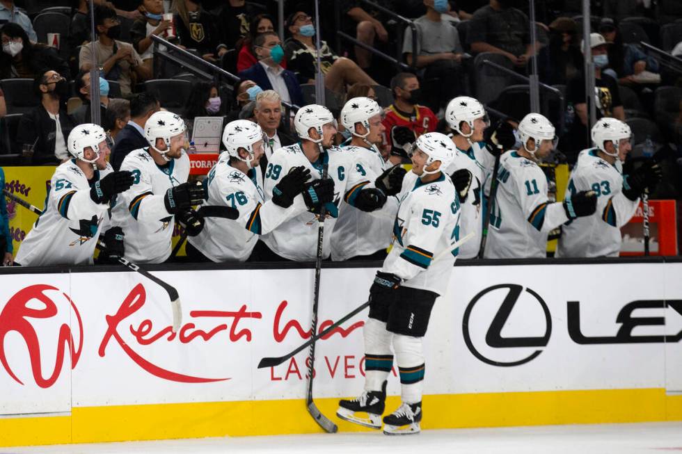 Sharks center Alexander Chmelevski (55) is congratulated by his team after scoring a goal on th ...