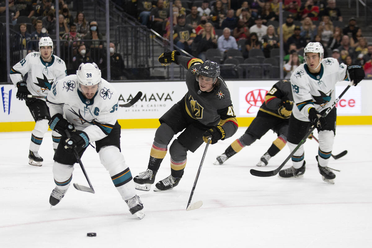 Sharks center Logan Couture (39) and Golden Knights forward Nolan Patrick (41) skate for the pu ...