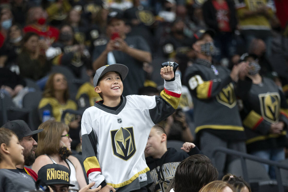 A fan dances to the big screen during a preseason NHL hockey game between the Golden Knights an ...