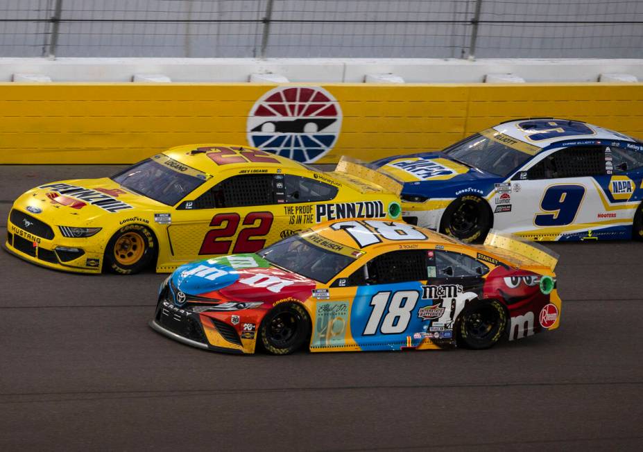 Kyle Busch (18) Joey Logano (22) and Chase Elliot (9) race during the 4th Annual South Point 40 ...