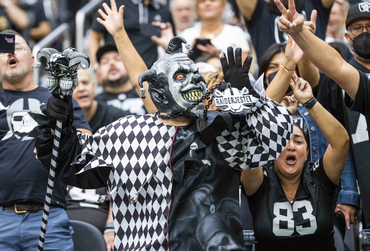 The Raiders Jester with other fans in the stands during the first half of their NFL game versus ...