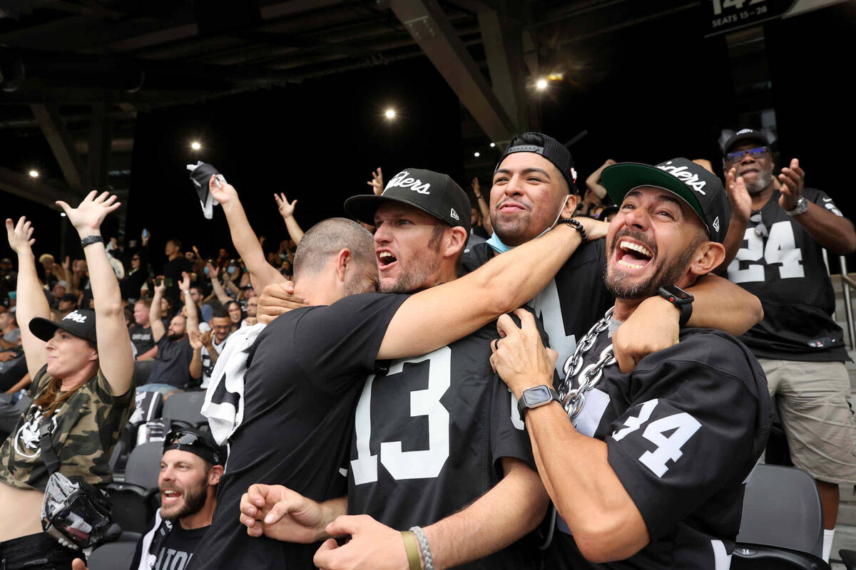 Fans, including, from right, Rob Lujan of Las Vegas, Ivan Castro of San Leandro, Erik Wood of L ...