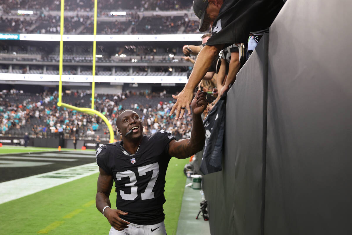 Las Vegas Raiders safety Tyree Gillespie (37) greets fans after an overtime win against the Mia ...