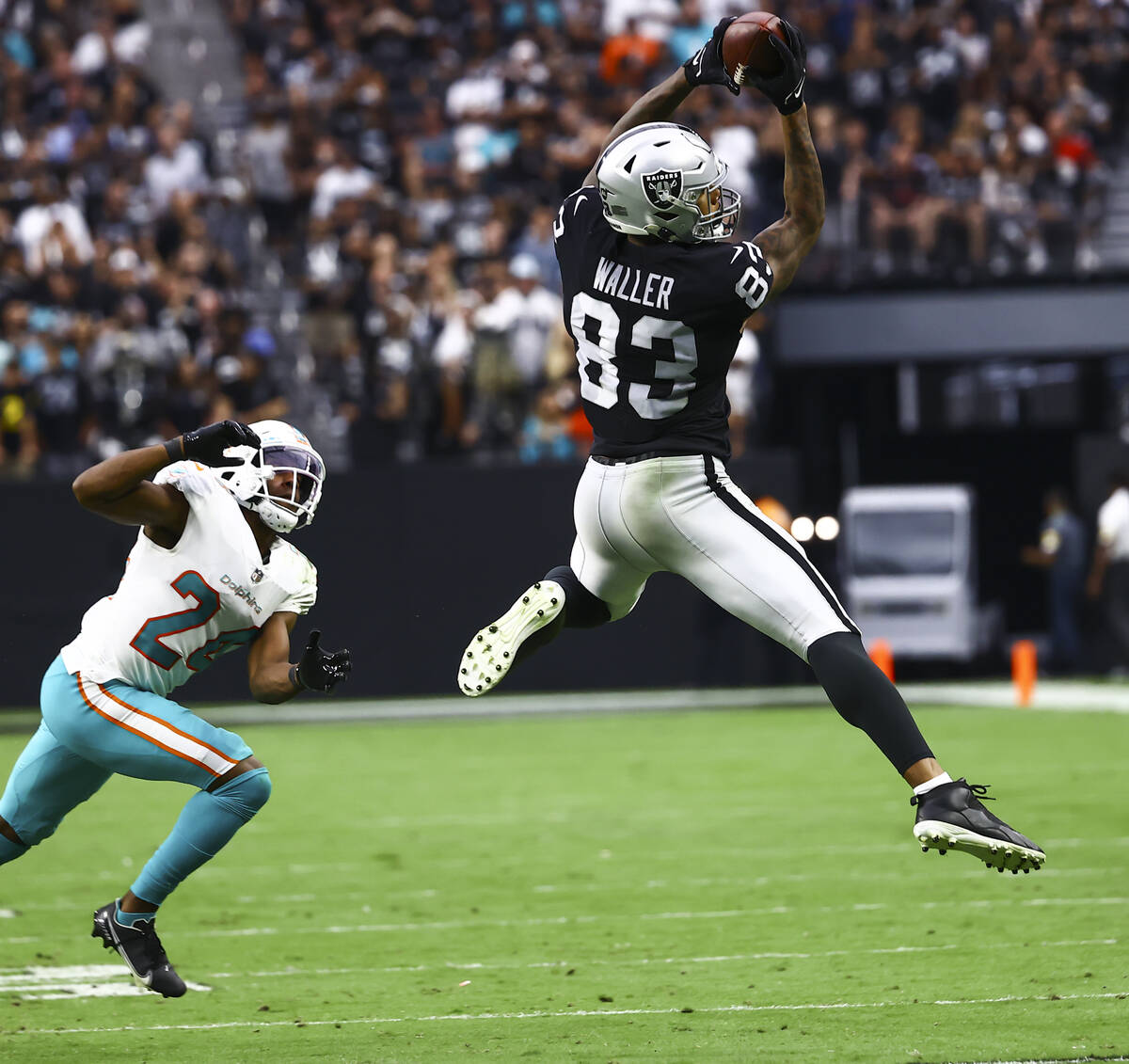 Raiders tight end Darren Waller (83) makes a reception in front of Miami Dolphins cornerback By ...