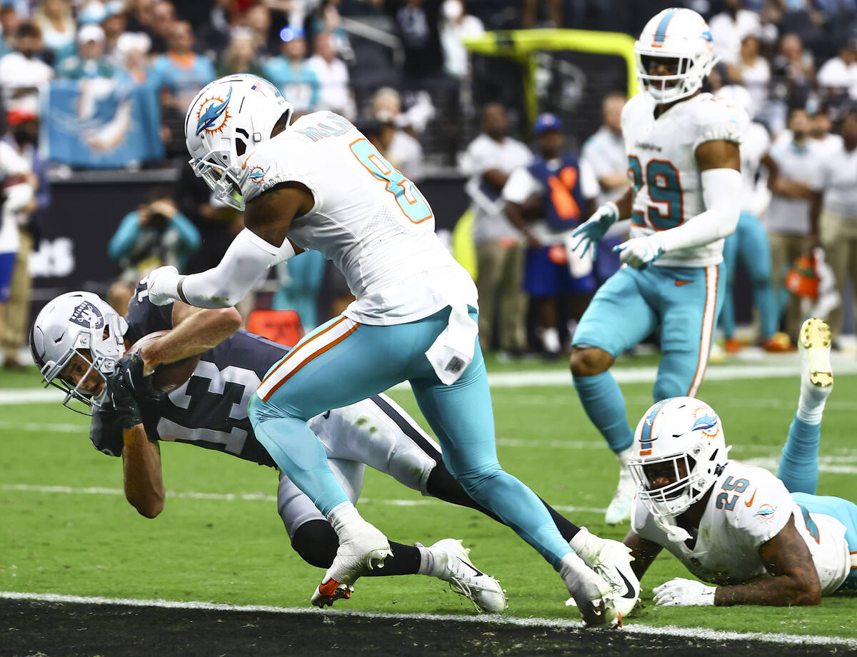 Raiders wide receiver Hunter Renfrow (13) scores a touchdown in front of Miami Dolphins free sa ...