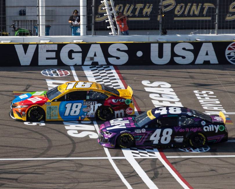 Kyle Busch (18) and Alex Bowman (48) race during the 4th Annual South Point 400 race at Las Veg ...