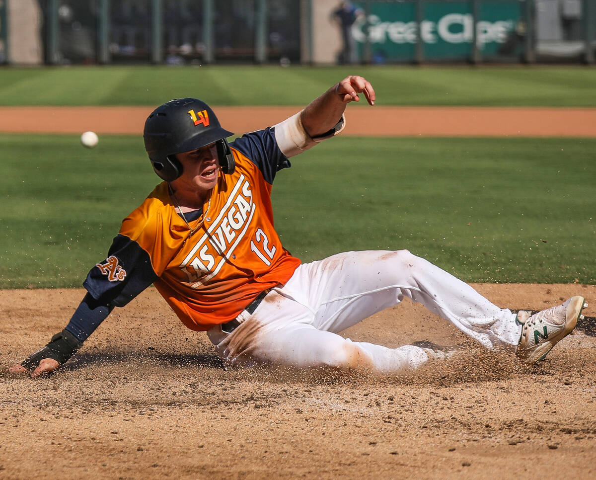 Las Vegas Aviators’ Nick Allen (12) slides to make home base in a game against the Oklah ...
