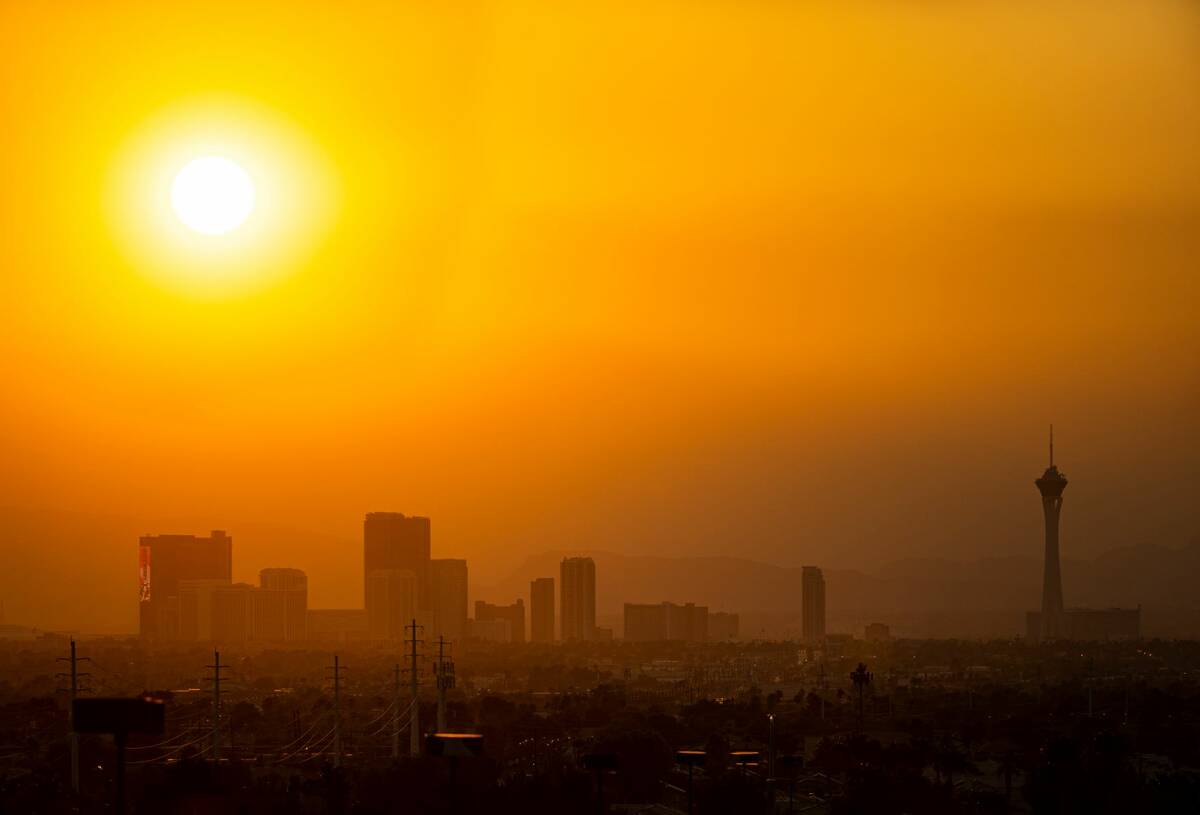 The sun shines through smoke and haze over the north end of the Las Vegas Strip in Las Vegas on ...