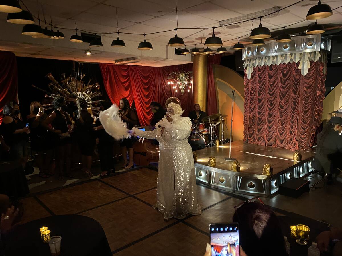 Skye Dee Miles is shown performing at "Backstory Pass," Usher's pre-show immersive production, ...