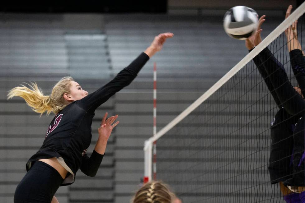 Faith Lutheran's Ella Swinn (10) spikes during a high school volleyball game against Durango at ...
