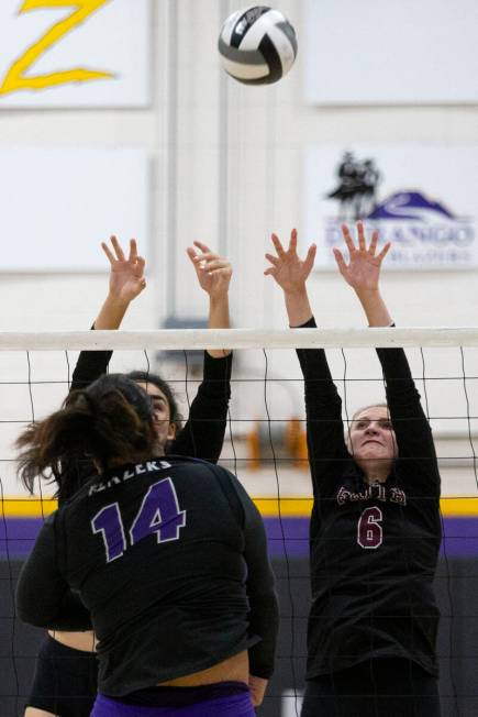Faith Lutheran's Haylee Strong, left, and Bianca Richardson (6) miss the kill as Durango's Draz ...