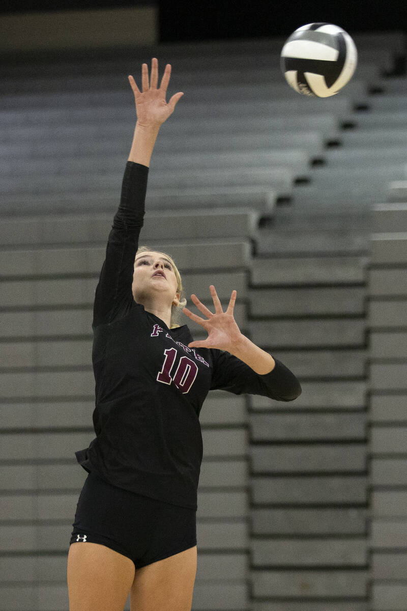 Faith Lutheran's Ella Swinn (10) jumps to spike during a high school volleyball game against Du ...