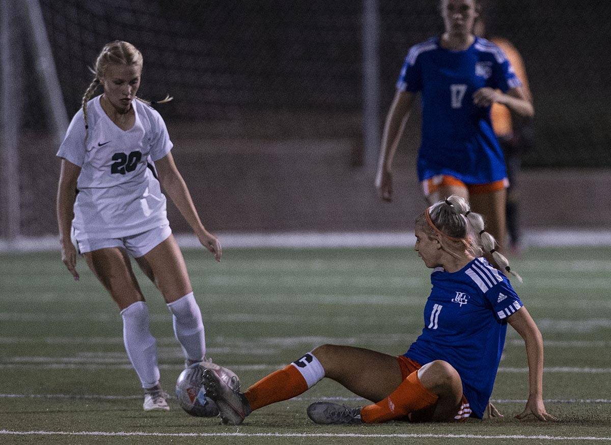 Palo Verde’s Kamryn Klinger (20) tries to recover the ball from Bishop Gorman’s Michelie Ma ...