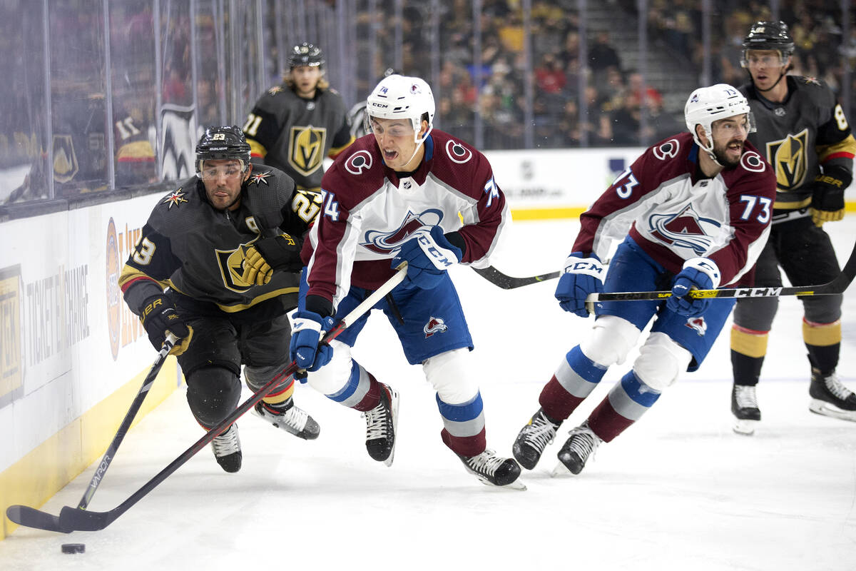 Vegas Golden Knights defenseman Alec Martinez (23) and Colorado Avalanche right wing Alex Beauc ...