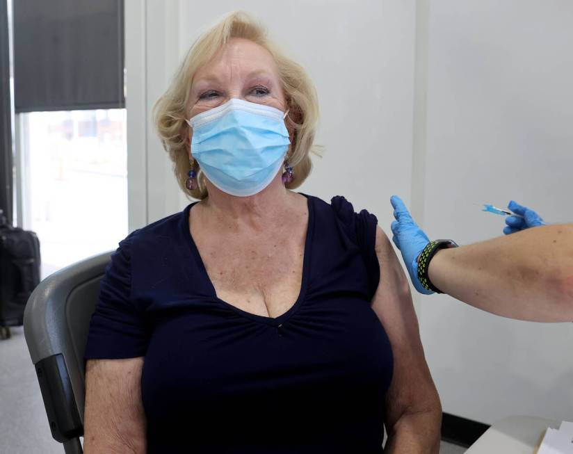 Algene Evans Wucinich of Las Vegas gets a Pfizer COVID-19 vaccine booster shot at the Southern ...