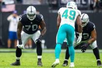 Raiders offensive tackle Alex Leatherwood (70) and Raiders offensive tackle Jermaine Eluemunor ...