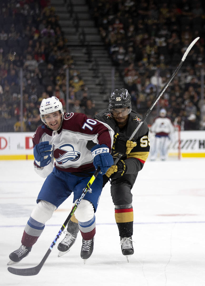 Avalanche right wing Nick Henry (70) and Golden Knights right wing Keegan Kolesar (55) collide ...