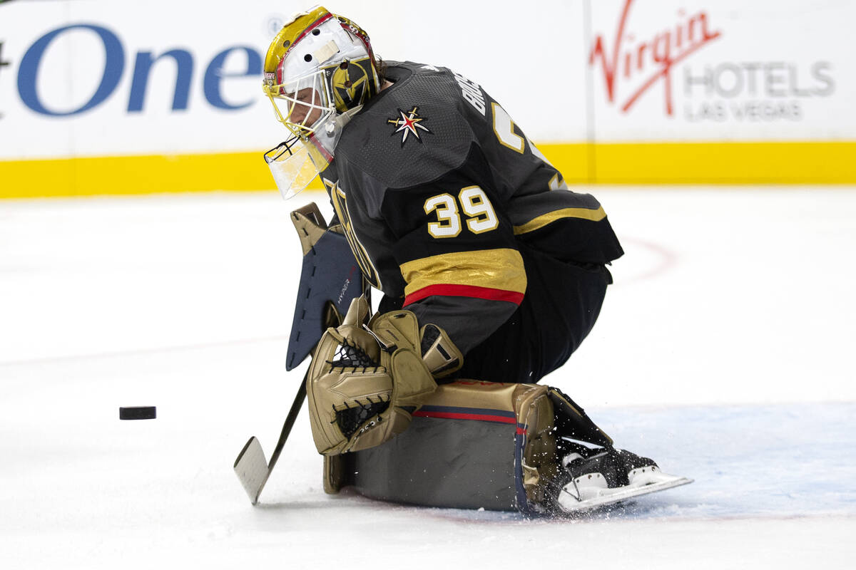 Golden Knights goaltender Laurent Brossoit (39) is about to save a shot on goal by the Avalanch ...