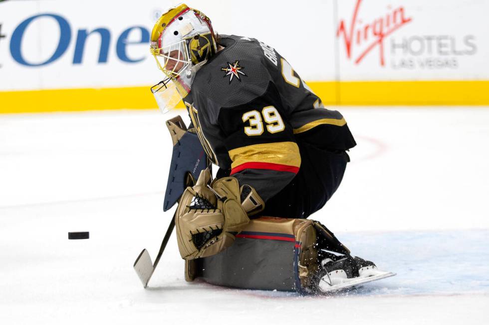 Golden Knights goaltender Laurent Brossoit (39) is about to save a shot on goal by the Avalanch ...